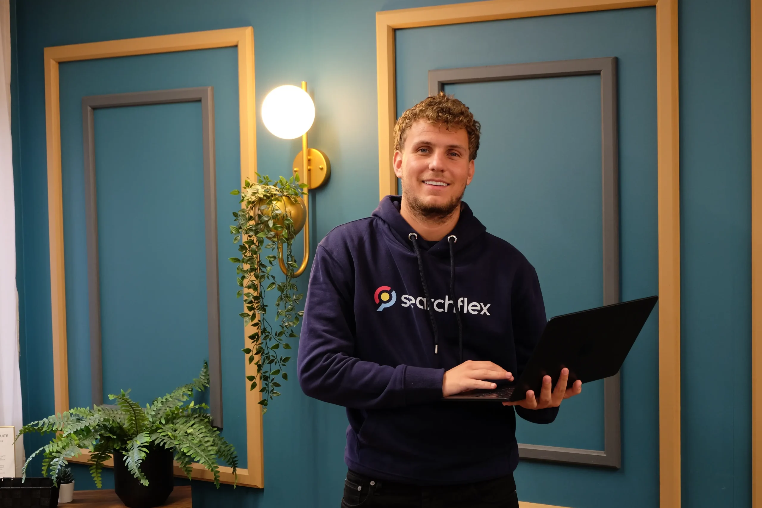Searchflex digital marketing consultant using a laptop to manage SEO campaigns and online marketing strategies